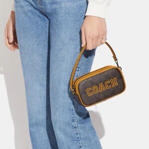 Coach JAMIE WRISTLET IN SIGNATURE CANVAS WITH VARSITY MOTIF New